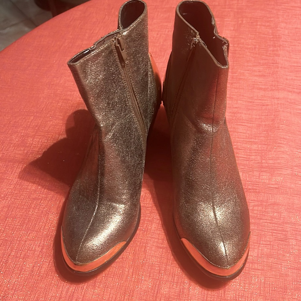 Women’s bronze boots, size 10M.